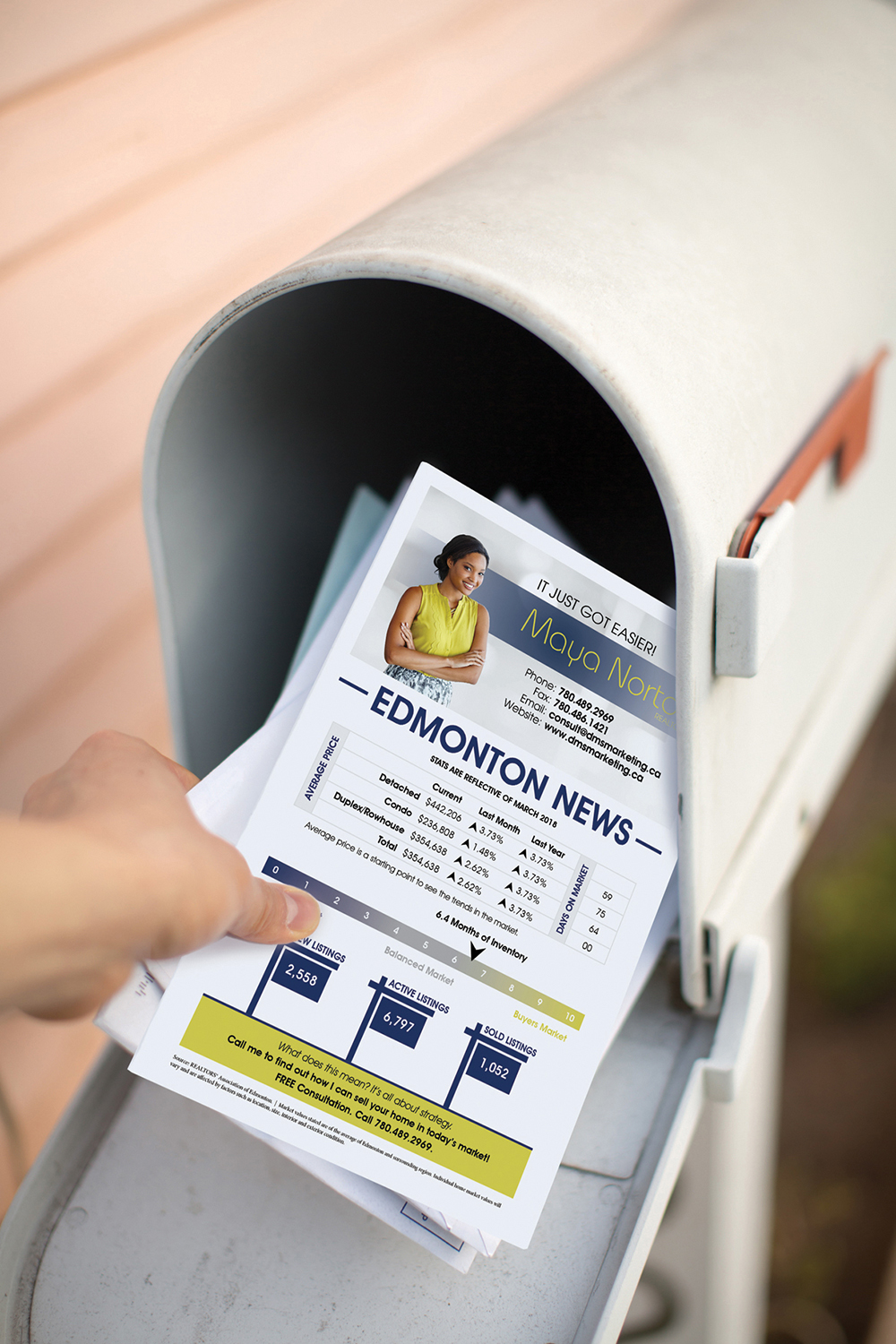Person receiving business builder brochure from mailbox.