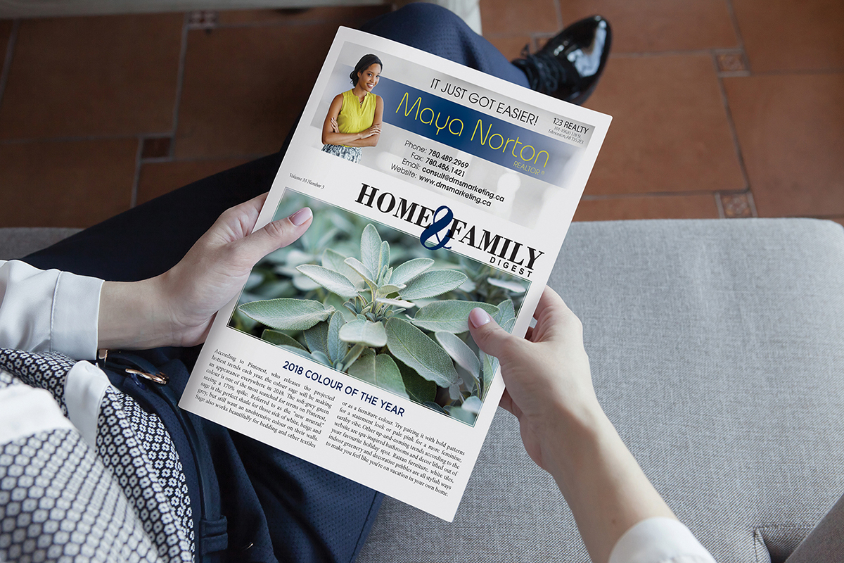 Woman holding newsletter on lap.